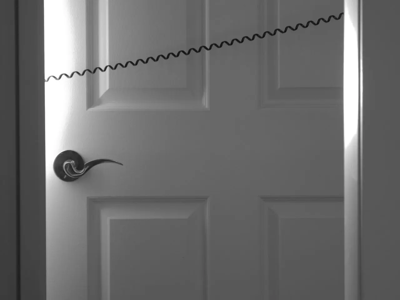 a door with a telephone cord attached to it